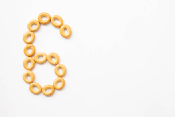 number 6 made from cookies on a white background with space for text. layout for school or diet
