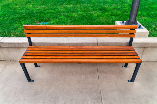 park bench on lawn at sunset