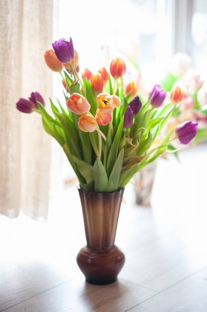 istock bouquet tulips on the window 1244500569