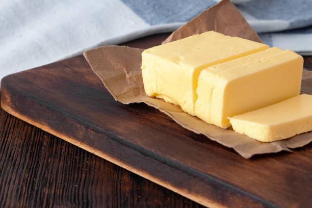 istock Cut butter on plate with blue towel on kitchen table 1244501641