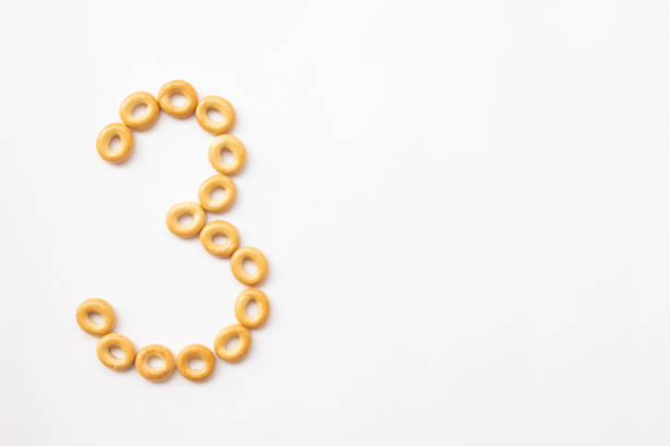 istock number 3 made from cookies on a white background with space for text. layout for school or diet 1244507229