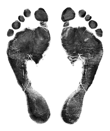 Pair of Black Footprints on White Background.