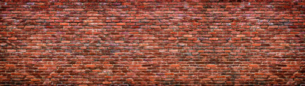 istock Old brick wall background. Panoramic texture of red stone. 1244538526