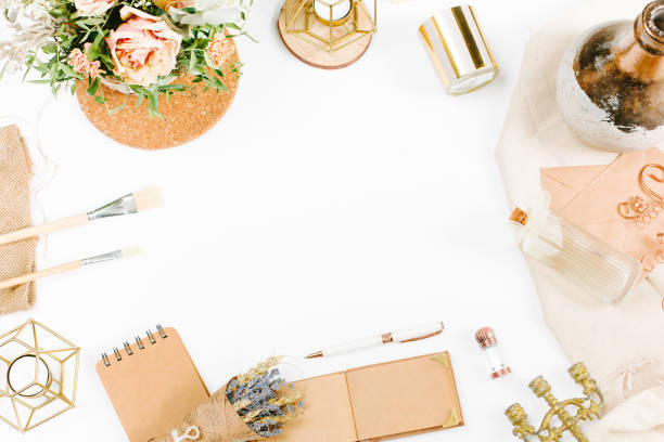 istock Creative template in vintage style for wedding or birthday invitation card with envelope, candlestick, vase, flowers and brushes. An elegant workspace of creative man. Flat lay, top view 1244561946