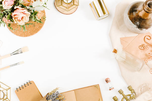 istock Creative template in vintage style for wedding or birthday invitation card with envelope, candlestick, vase, flowers and brushes. An elegant workspace of creative man. Flat lay, top view 1244561949