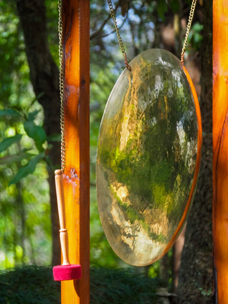 istock Huge shiny Buddhist gong hanging in frame next to mallet in Nepal 1244564315