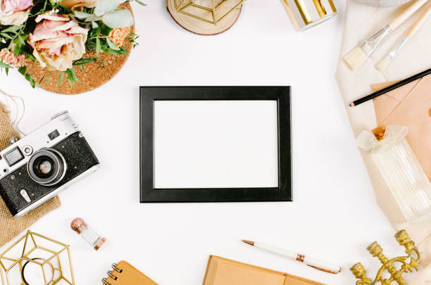 istock Creative template in vintage style for wedding or birthday invitation card with frame, envelope, candlestick, vase, flowers and brushes. An elegant workspace of creative man. Flat lay, top view 1244564889