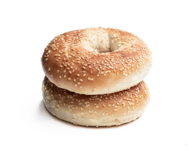 istock Pair of sesame seed bagels isolated on white background 1244564902