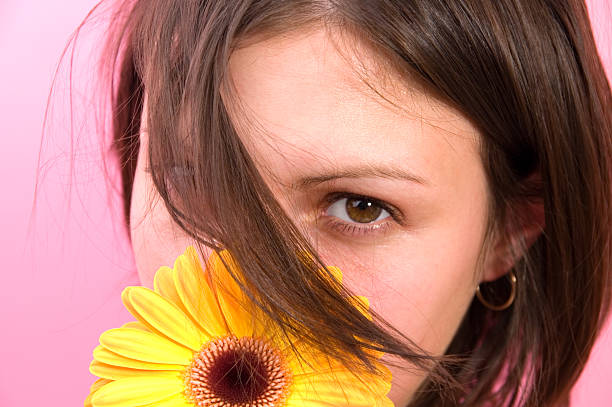 istock Young woman with flower 124456914