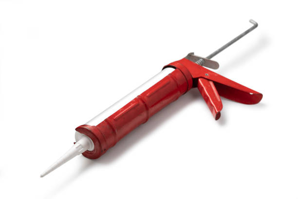 istock Work Tools: Caulk Gun Isolated on White Background 1244571568
