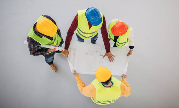 istock Group of architects and engineers looking at blueprint 1244572899