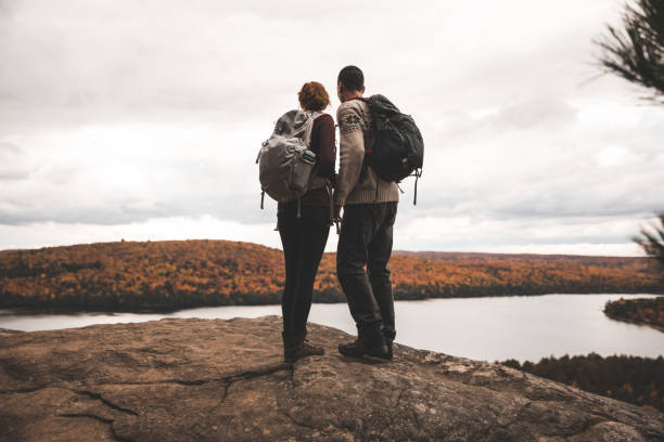 istock Young couple hiking in a beautiful natural park 1244580549