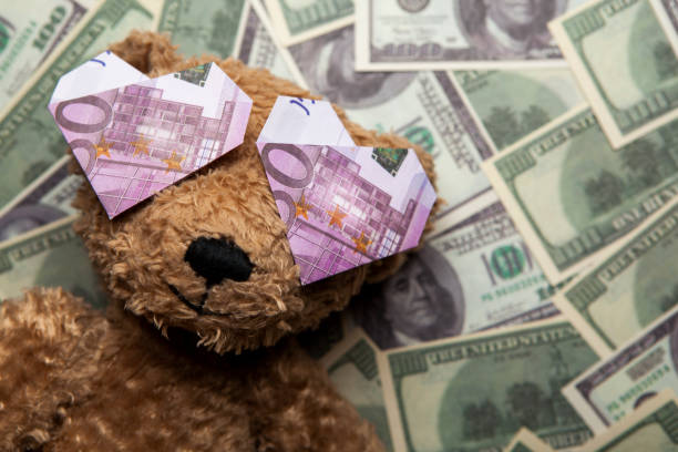 istock image of toy bear money background 1244581670