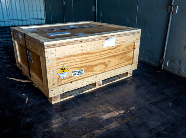 istock Radiation warning sign transport label Class 7 on the Dangerous goods package type A in the container of transport truck 1244596402