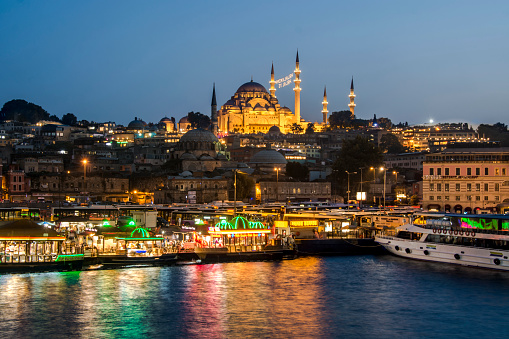 Night in Istanbul, Turkey with Suleymaniye Mosque (Ottoman imperial mosque). View from Galata Bridge in Istanbul. sunset