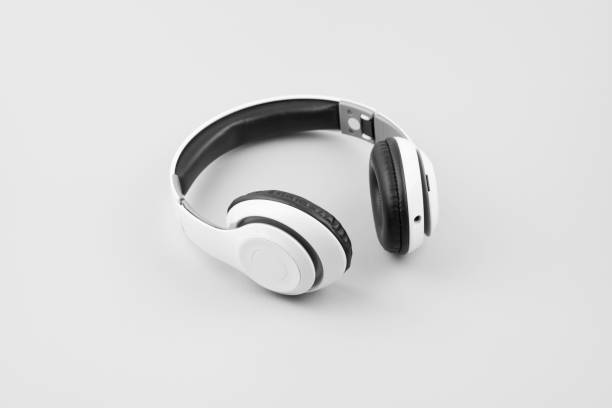 istock White wireless headphones isolated on white background. Monochrome. Black and white. 1244601855