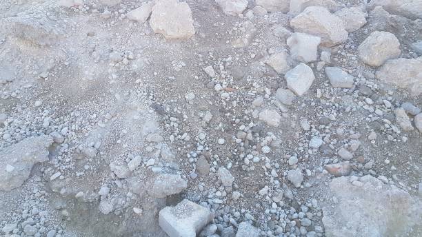 istock Rough sand and stone construction waste industrial background 1244605354