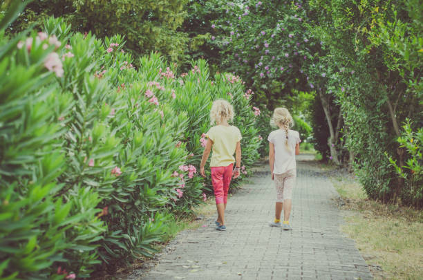 istock child and oleander flowers 1244633351