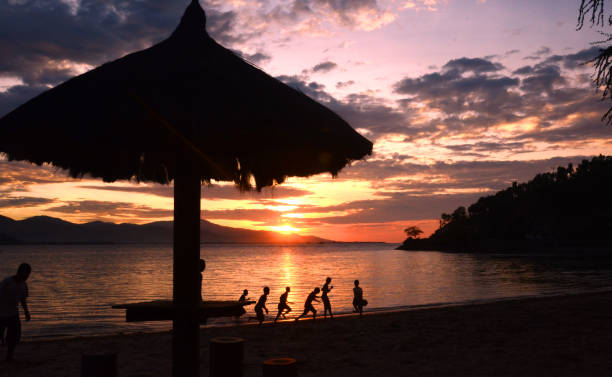 istock Silhouette picture of childrens playing alongside 1244636733