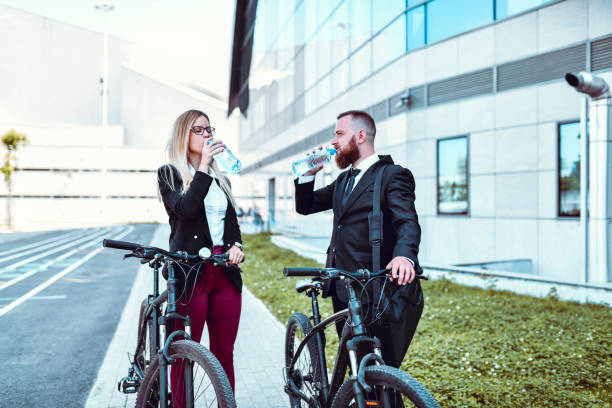 istock Elegant Couple Drinking Water While Cycling 1244651969