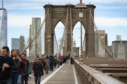 New York, USA, May 4, 2020. Some people are walking on the Brooklyn Bridge during the Covid-19 outbreak. The Brooklyn Bridge is a hybrid cable-stayed/suspension bridge in New York City, USA.