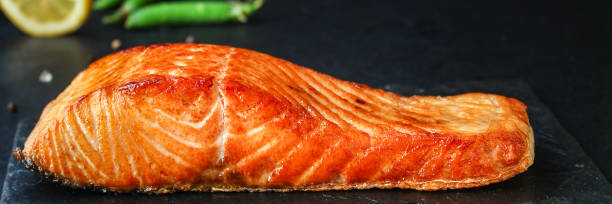 istock fried salmon barbecue grill Menu concept serving size. food background top view copy space for text keto or paleo pescatarian diet organic healthy eating 1244675379