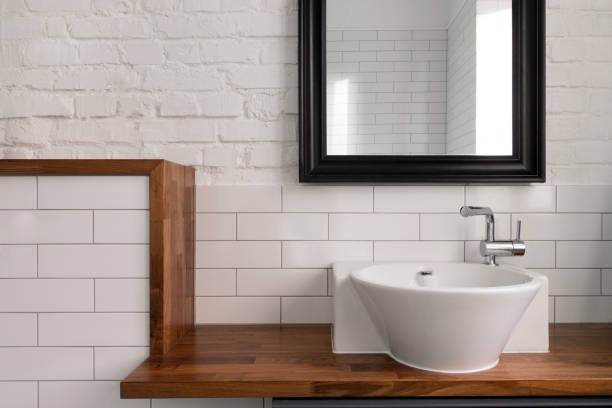 istock Interior of comfortable light bathroom with simple design 1244680333