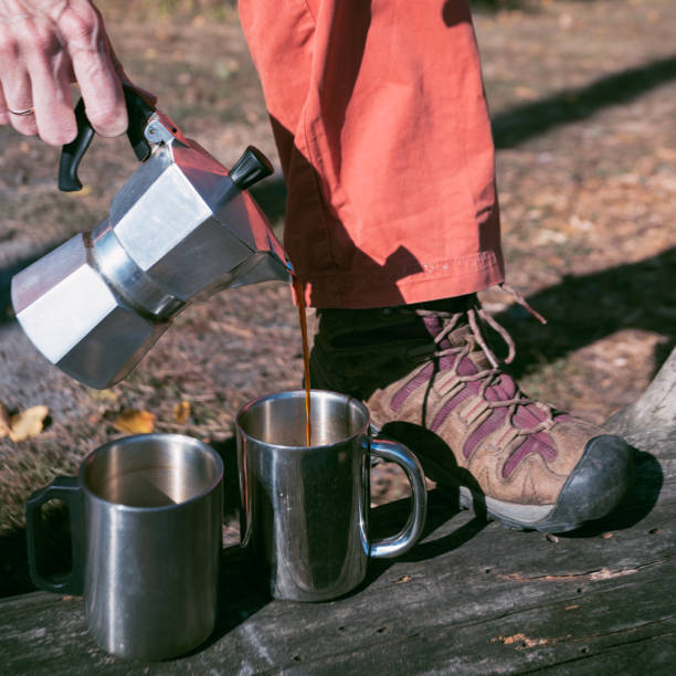 istock happy trip -  tourist pours coffee into cups from a geyser coffee maker 1244690799