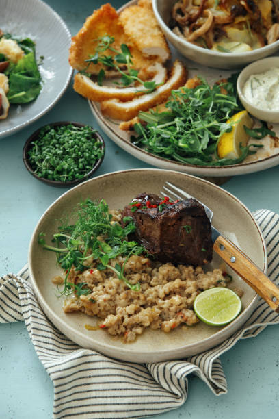 istock Beer-braised Beef Cheek with Pearl Barley Risotto 1244712060