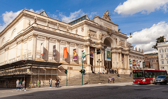 Rome, Italy - February 13, 2016: Ordinary people are near The Palazzo delle Esposizioni, a neoclassical exhibition hall, cultural center and museum on Via Nazionale in Rome