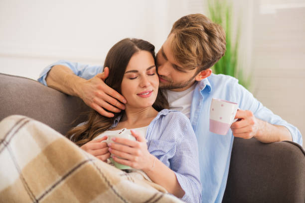 istock Young happy couple having morning coffee and feeling peaceful 1244753369