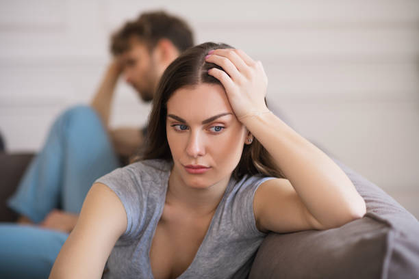 istock Young woman sit looking sad after a bad talk with her husband 1244754550