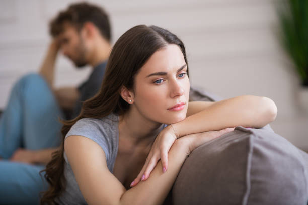 istock Young woman sit looking upset after a bad talk with her husband 1244754553