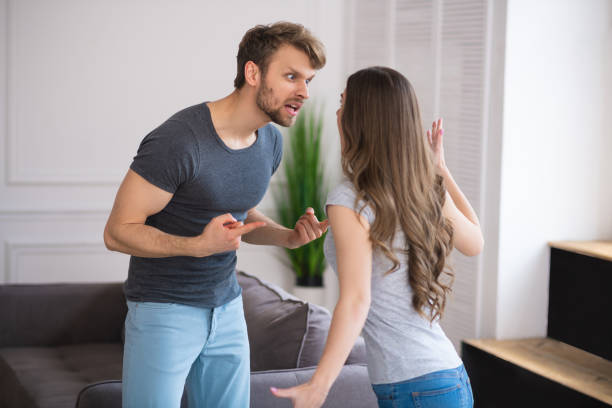 istock Young couple having a quarrel and looking agressive 1244754573