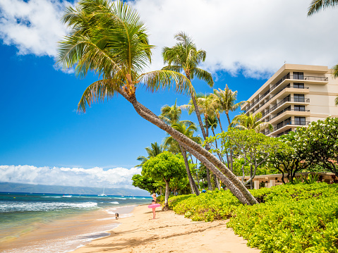 Looking of Kaanapali Beach, Maui, Hawaii. With three miles of white sand and crystal clear water, no wonder why Kaanapali Beach was once named America Best Beach