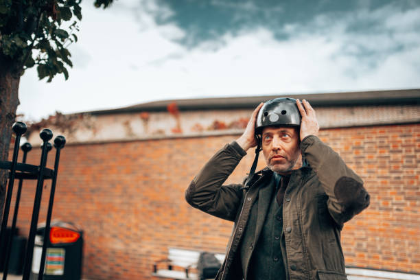 istock man with a bike helmet portrait 1244762785