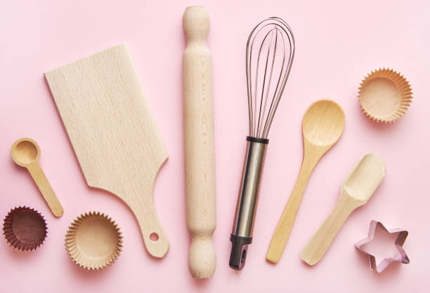 istock Baking concept and  wooden kitchen supplies on pastel pink background. baking tools background flat lay. Backing tools background top view. 1244765611