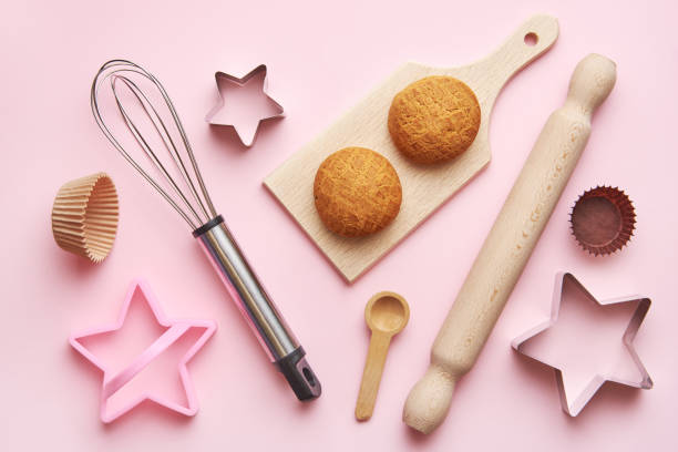 istock Baking concept and  wooden kitchen supplies on pastel pink background. baking tools background flat lay. Backing tools background top view. 1244765623