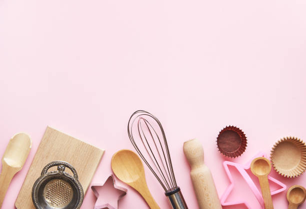 istock Baking concept and  wooden kitchen supplies on pastel pink background. baking tools background flat lay. Backing tools background top view. 1244766183