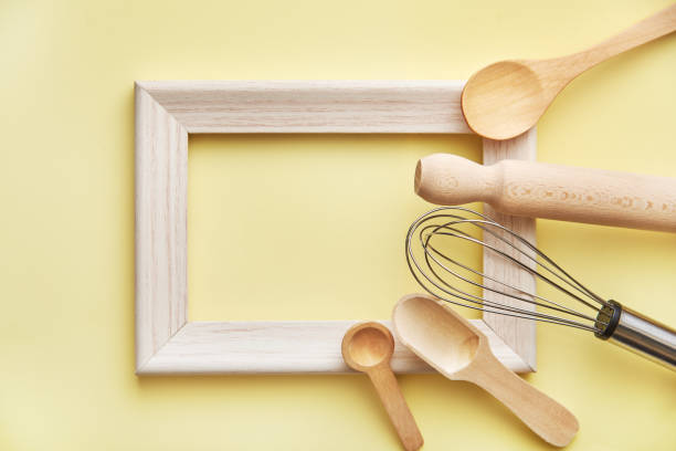 istock Baking kitchen supplies on pastel yellow background. Kitchen supplies flat lay. 1244766729