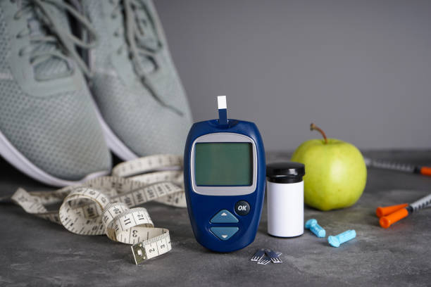 Concept of a healthy lifestyle, glucometer and lancet pen, close-up. Diabetes. Sports diabetic. stock photo