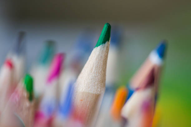 istock Green pencil nib surrounded by other pencils 1244778163