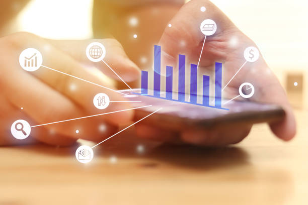 istock Man using using smart phone to check his stock finance graphic, internet wireless application development sync app,virtual graphic icon 1244786609