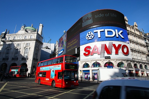 People visit Piccadilly Circus in London, UK. London is the most populous city in the UK with 13 million people living in its metro area.