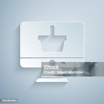 istock Paper cut Computer monitor with shopping basket icon isolated on grey background. Online Shopping cart. Supermarket basket symbol. Paper art style. Vector Illustration 1244841654