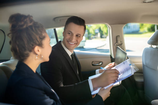 istock Attractive man signing document and woman in car 1244846579
