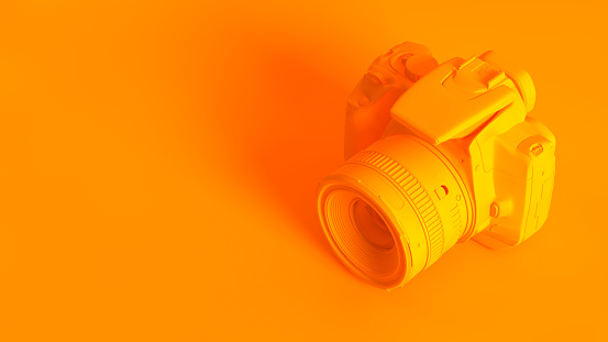 Conceptual stereoscopic image of 3d rendered DSLR camera, fully toned in orange color.