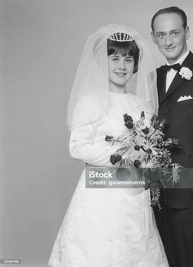 Wedding Day Vintage portrait of a caucasian couple on their wedding day back in 1966. Wedding Stock Photo