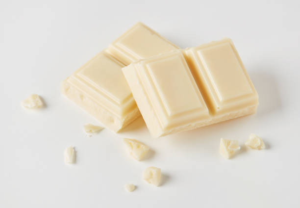 White chocolate pieces White chocolate chunks on white background chocolate bar photos stock pictures, royalty-free photos & images