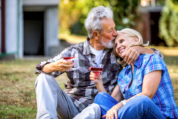 istock Couple Drinking Wine In Park 1244878995
